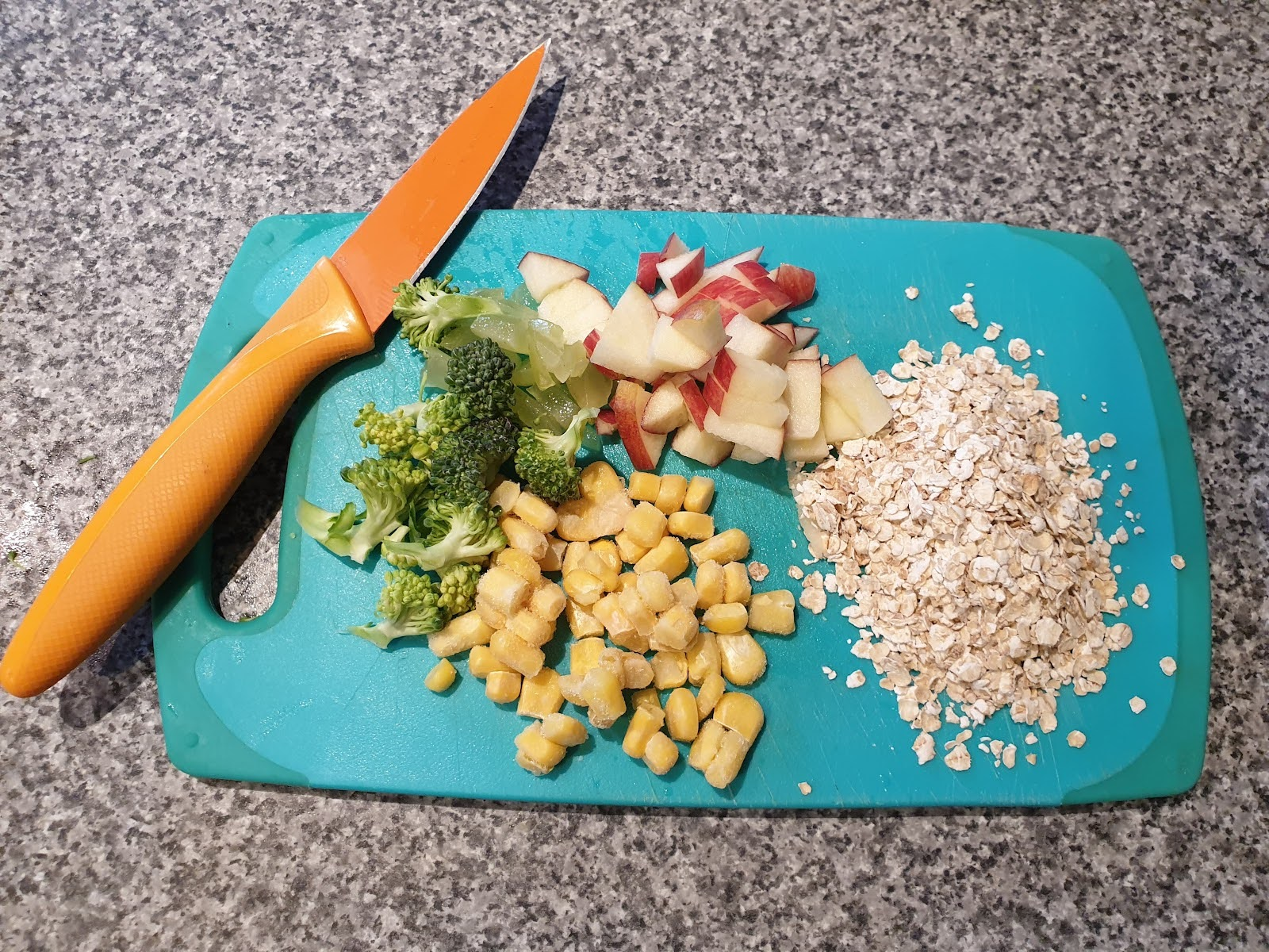 Two cute birds sitting next to each other 