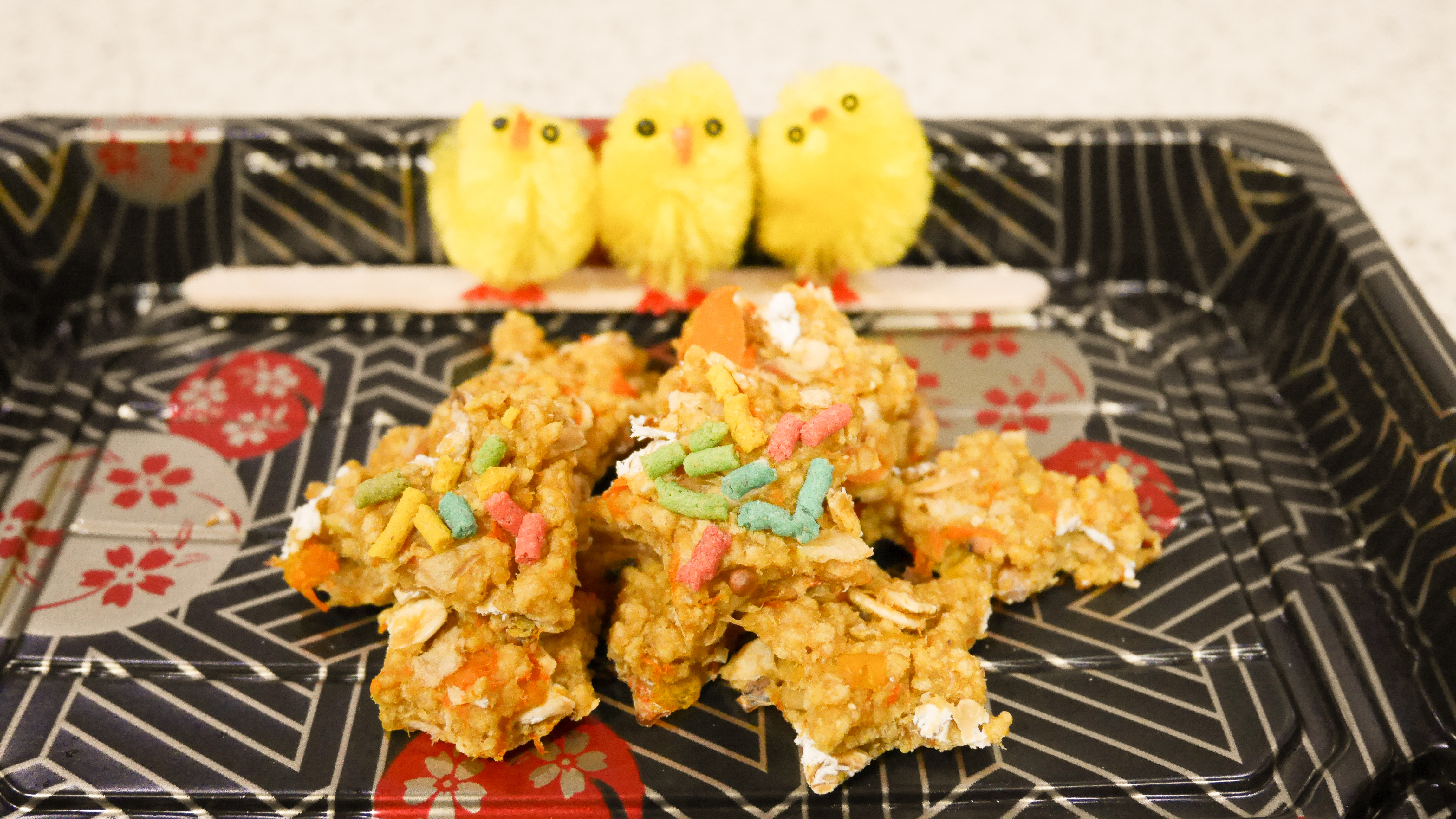 Healthy parrot cookies and toy baby chicken for decoration